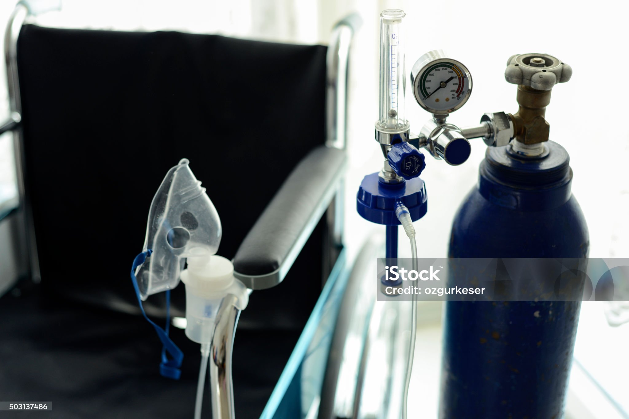 Close-Up Image Of Medical Oxygen Tube And The Wheelchair Behind It.